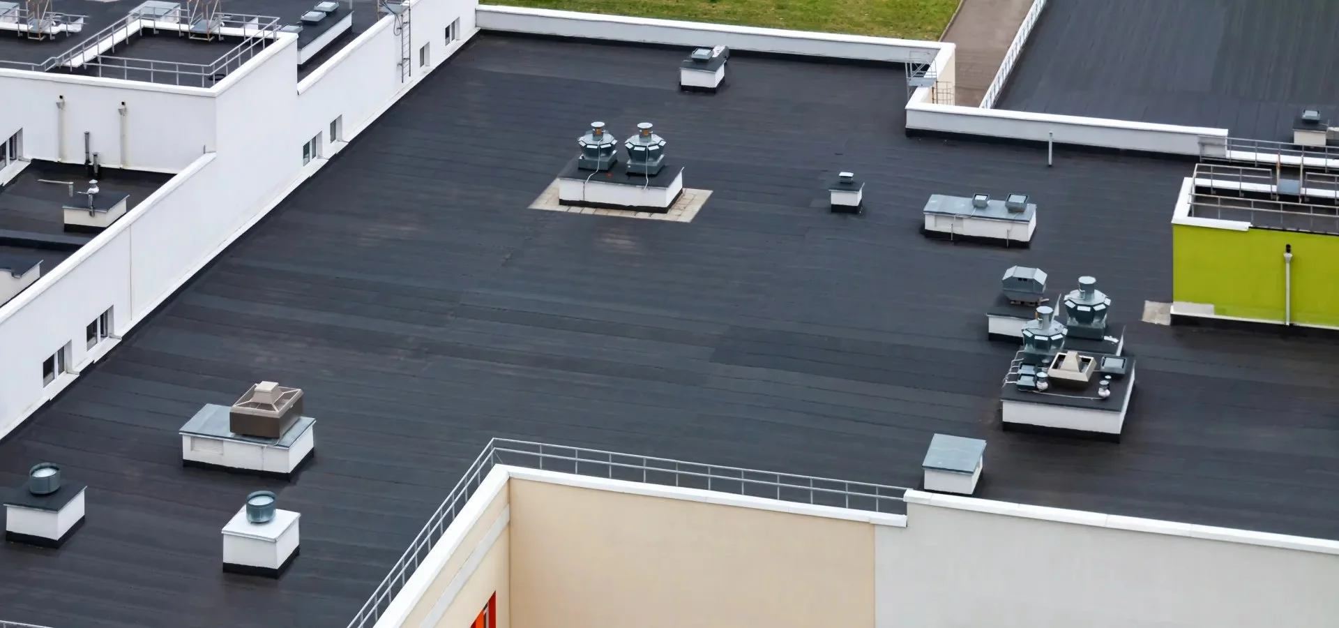 Flat commercial roof with rooftop vents